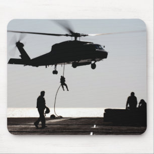 Personnel fast-rope out of an SH-60F Mouse Pad