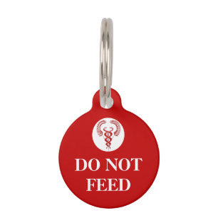 Pet health warning - do not feed caduceus tag