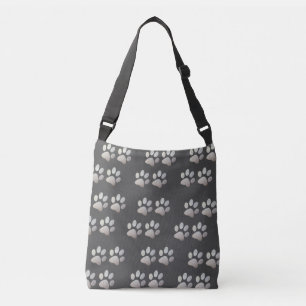 Pet paw silver glitter print on grey background crossbody bag