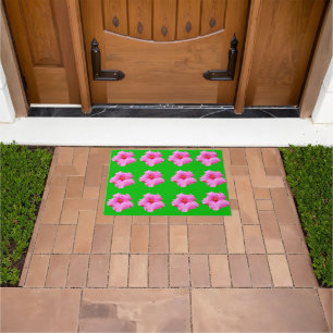 "Petal Serenity: Pink Hibiscus on a Green Canvas Doormat