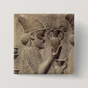Phoenician carrying two offering, detail relief 15 cm square badge