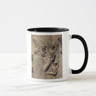Phoenician carrying two offering, detail relief mug
