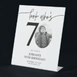 Photo 70th Birthday Welcome Sign | Look Who's 70<br><div class="desc">Welcome guests to your 70th birthday celebration with this stunning editable welcome sign. Featuring a sleek, customizable layout, this template allows you to easily add your own photo and personalize the text, making it a perfect addition to your milestone 70th birthday decor. Ideal for entryways or as a party focal...</div>