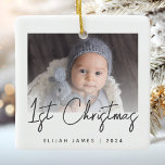Photo Baby's First Christmas Grey Script Ceramic Ceramic Ornament<br><div class="desc">Celebrate baby's first Christmas with this modern minimalist photo keepsake ornament. The charcoal grey text reads "1st Christmas" in trendy handwriting script. Easily replace the sample image with your favourite photo,  and add baby's name and the year below. A white gradient screen helps make the text overlay pop.</div>