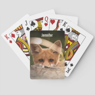 Photo of a Cute Little Orange Fox Playing Cards