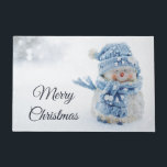 Photo of a Cute Snowman in Winter - Christmas Doormat<br><div class="desc">Doormat with a cute photograph of a little snowman. Standing outside in the winter with snow falling all around. This cute little guy is dressed up in blue knitted hat and scarf.</div>