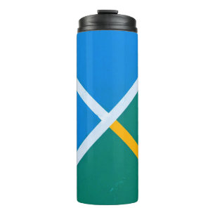 Photo of blue and green pavement thermal tumbler