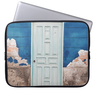 PHOTO OF BUILDING WITH WHITE WOODEN DOOR LAPTOP SLEEVE