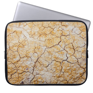 Photo of dried brown soil laptop sleeve