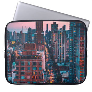PHOTO OF HIGH-RISE BUILDINGS WITH BLUE AND PINK SK LAPTOP SLEEVE