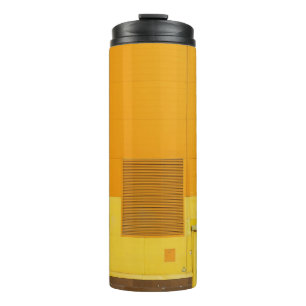 PHOTO OF YELLOW AND WHITE PAINTED WALL THERMAL TUMBLER