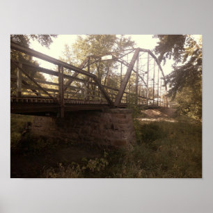 Photograph of an old, rusty iron truss bridge poster