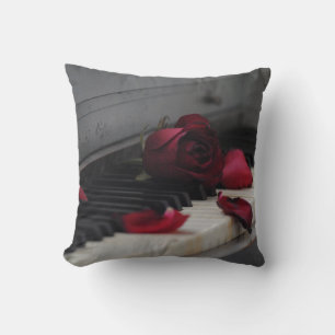 Piano Keys with a Red Rose Cushion