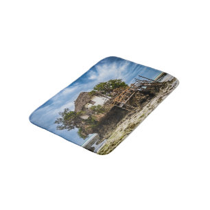 Picturesque house on a tropical coral outcrop bath mat