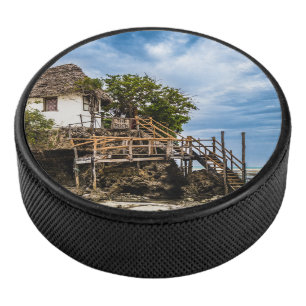 Picturesque house on a tropical coral outcrop hockey puck