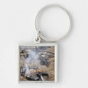 Pieces of enemy weapons lay out to cool off key ring