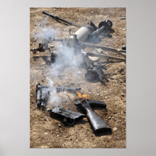 Pieces of enemy weapons lay out to cool off poster