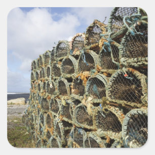 pile of lobster crab pots on Irish shoreline Square Sticker