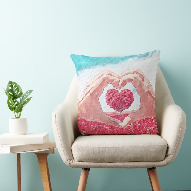 Pillow with heart in between open heart hands (Chair)