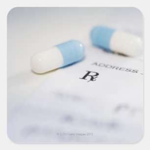 Pills on written prescription square sticker