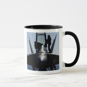 Pilots conducts a pre-flight inspection mug