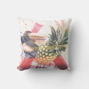 Pineapple beside phone and speaker cushion