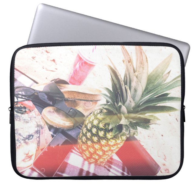 Pineapple beside phone and speaker laptop sleeve (Front)