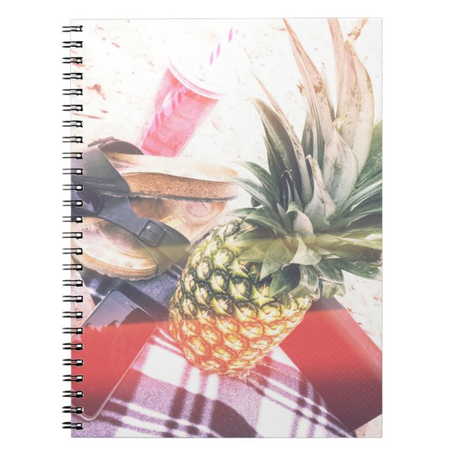 Pineapple beside phone and speaker notebook (Front)