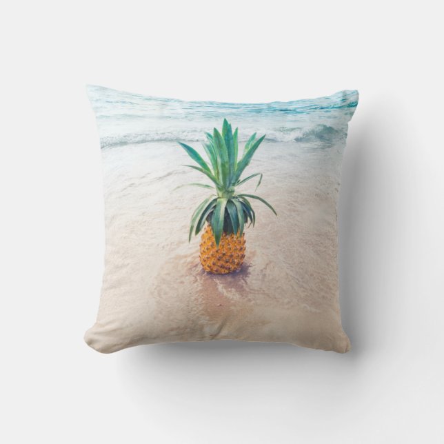 Pineapple fruit on beach shore in the morning cushion (Front)