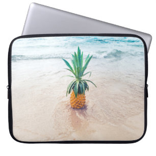 Pineapple fruit on beach shore in the morning laptop sleeve