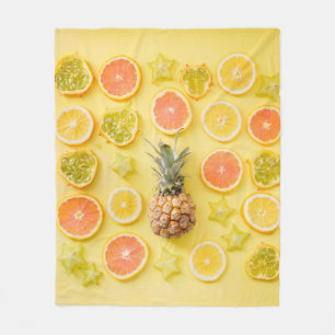 Pineapple surrounded by citrus fruits fleece blanket