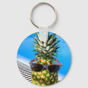 Pineapple wearing sunglasses at swimming pool key ring