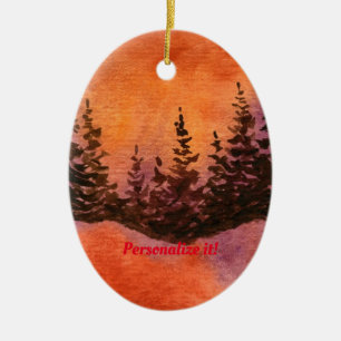 Pines on a hill with soft red sunset ceramic ornament