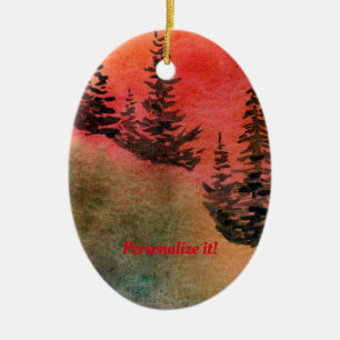 Pines on a hill with soft red sunset ceramic ornament