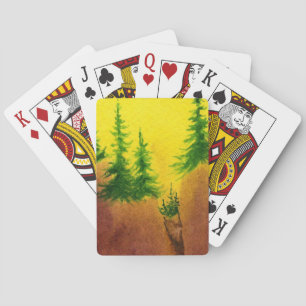 Pines on a sheer cliff face intense yellow sunrise playing cards