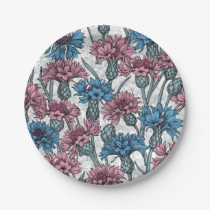 Pink and blue cornflowers, wild flowers on white paper plate