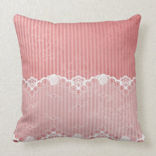 Pink and white background with black lace cushion