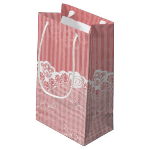 Pink and white background with black lace small gift bag