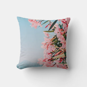 Pink and white petaled flowers cushion