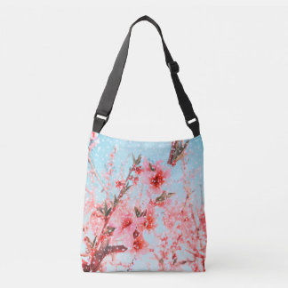 Pink blossom and flying petals (or snow?) crossbody bag