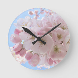 Pink Blossoms Blue Sky. Round Clock