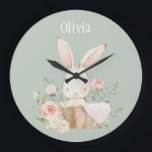 Pink Blush Bunny Sage Green Name Nursery Clock<br><div class="desc">Cute and sweet pink watercolor bunny rabbit with floral accents all around in a wicker basket. Soft sage green background.  Add your choice of name. Adorable.  100% customer satisfaction with Zazzle every day.</div>