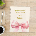 Pink bow beige cream quote 2026 planner<br><div class="desc">A soft beige,  cream coloured background,  decorated with a large pink bow.  Quote: Live with intention.  Plan with purpose.</div>