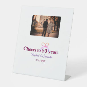 Pink bow cheers to 50 years anniversary wedding pedestal sign