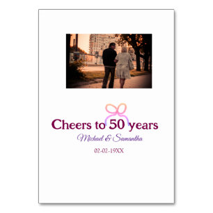 Pink bow cheers to 50 years anniversary wedding  table number