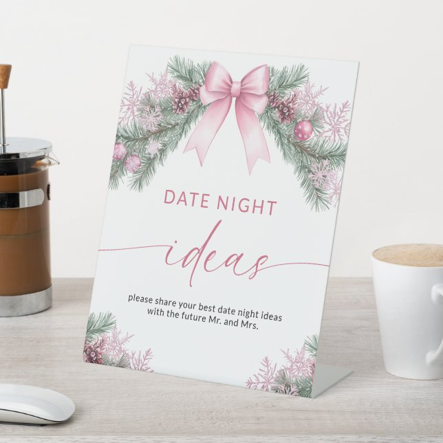 Pink Bow Christmas Date Night Ideas sign (In SItu)