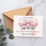 Pink bow cream birthday party Save the Date card<br><div class="desc">A modern and elegant Save the Date for a birthday party (any age).   A soft cream,  beige coloured background,  decorated with a large pink bow. Personalise and add date,  place,  name and age.</div>
