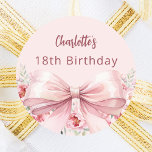 Pink bow florals birthday favours classic round sticker<br><div class="desc">A blush pink background. Decorated with a large pink bow and pink flowers. Personalise and add a name. Black handwritten style script.</div>