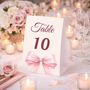 Pink bow ivory party table number