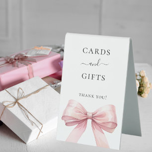 Pink bow white cards gifts sign
